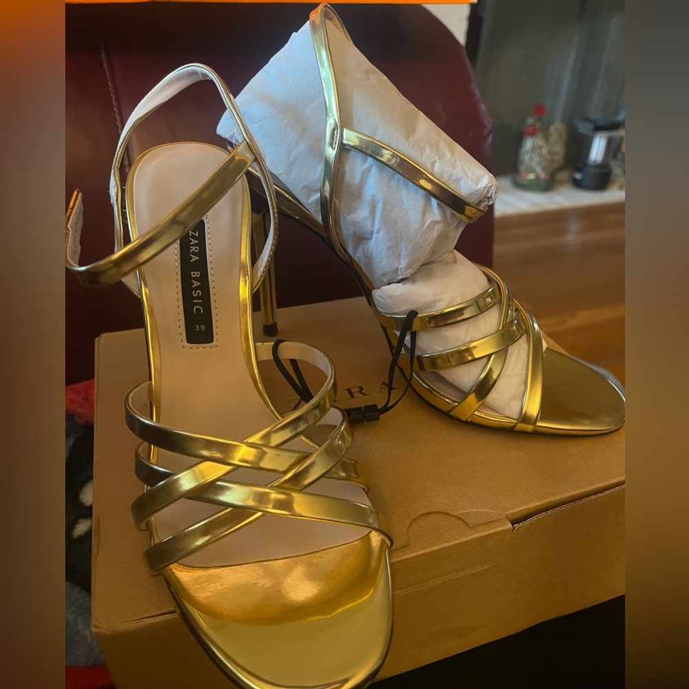 Never been worn. Gold strappy heels. Size 8